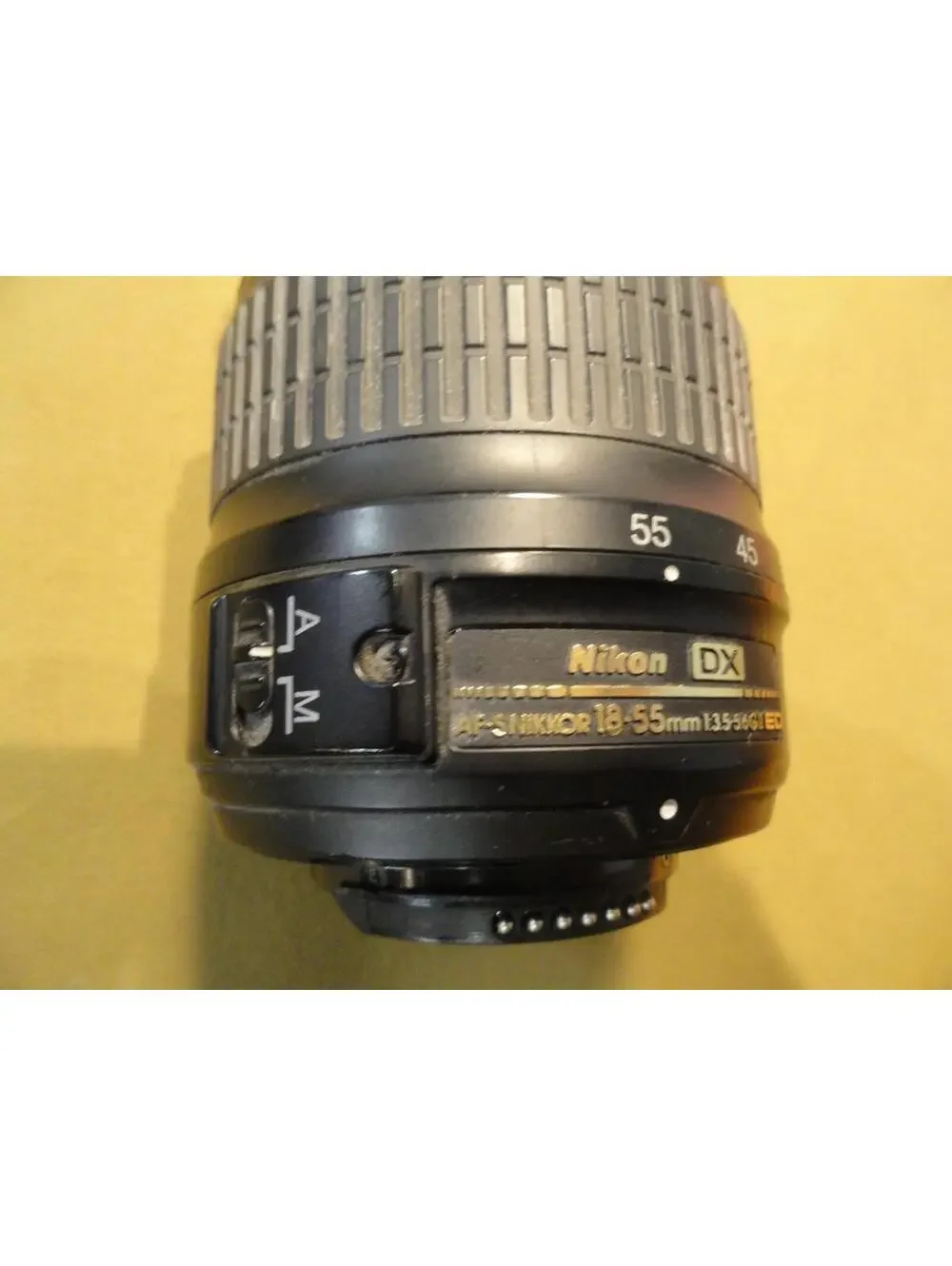 NIKON DX SWM ED ASPHERICAL 0.28M/0.92FT 52 US 6766543 18-55 MM 1:3.5-5.6 G II